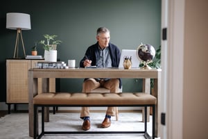man sitting at desk working from home